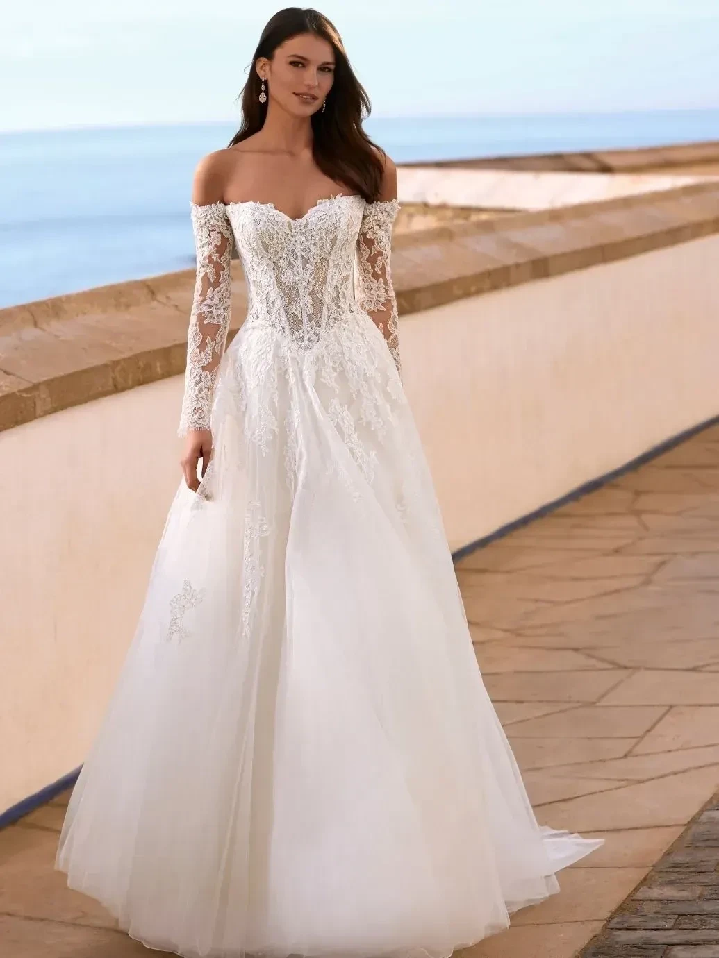 Model wearing a bridal Collection Gown by I Do Weddings & Photography